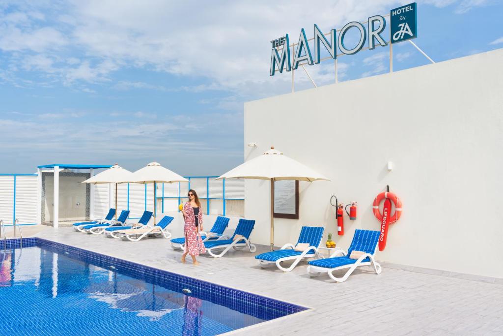 Bazén v ubytování The Manor By JA, Dubai nebo v jeho okolí