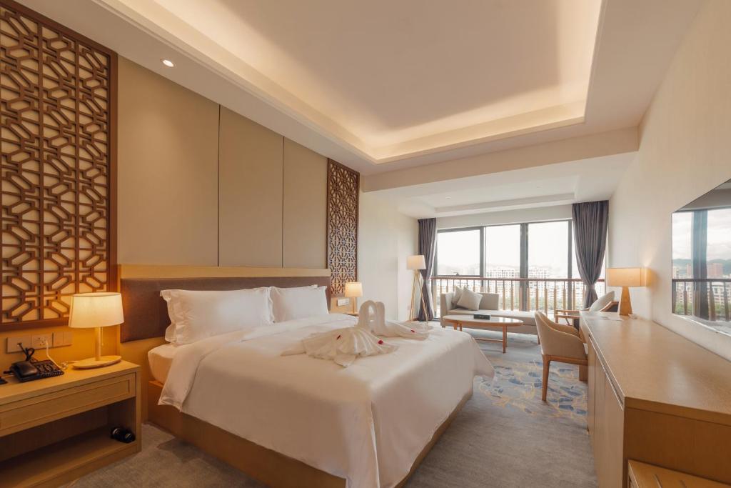 Postel nebo postele na pokoji v ubytování White Swan Guest House MeiZhou