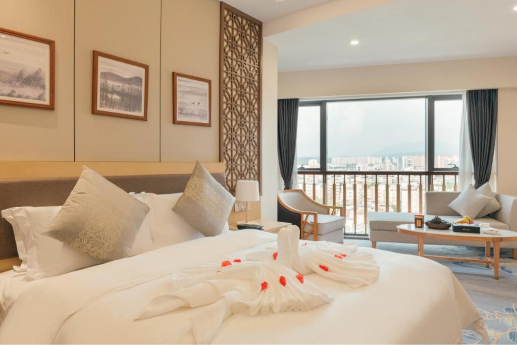 Postel nebo postele na pokoji v ubytování White Swan Guest House MeiZhou