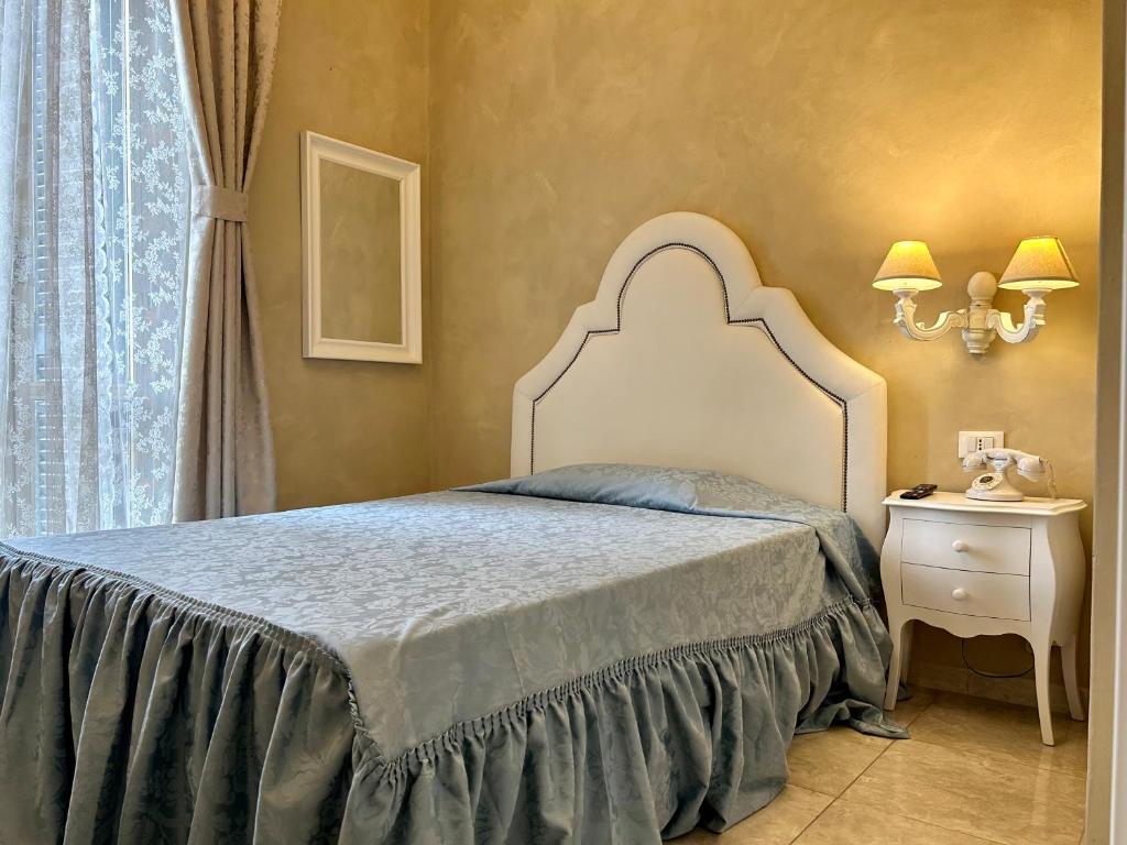 Postel nebo postele na pokoji v ubytování Boutique Hotel Calais Milano