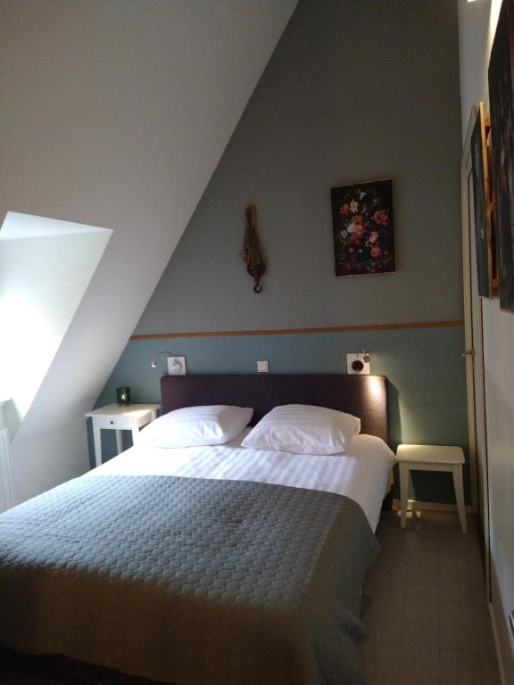 Кровать или кровати в номере Bed & Brasserie Het Kosthuys