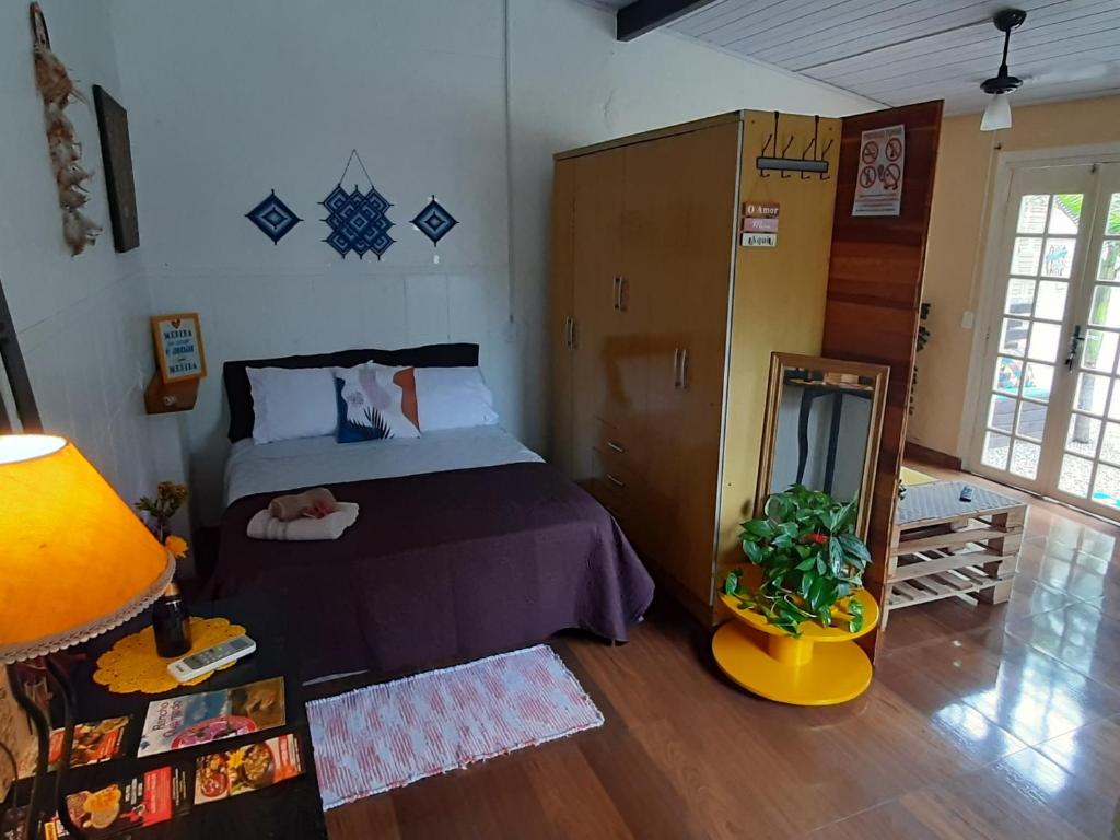 Villacasamarela mini casinhas de hospedes Rio vermelhoにあるベッド