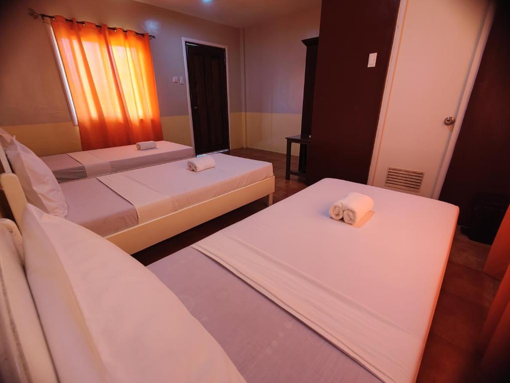 Postel nebo postele na pokoji v ubytování Calicoan Villa
