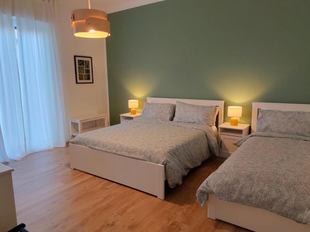 Postel nebo postele na pokoji v ubytování B&B Tanto Piacere Taranto