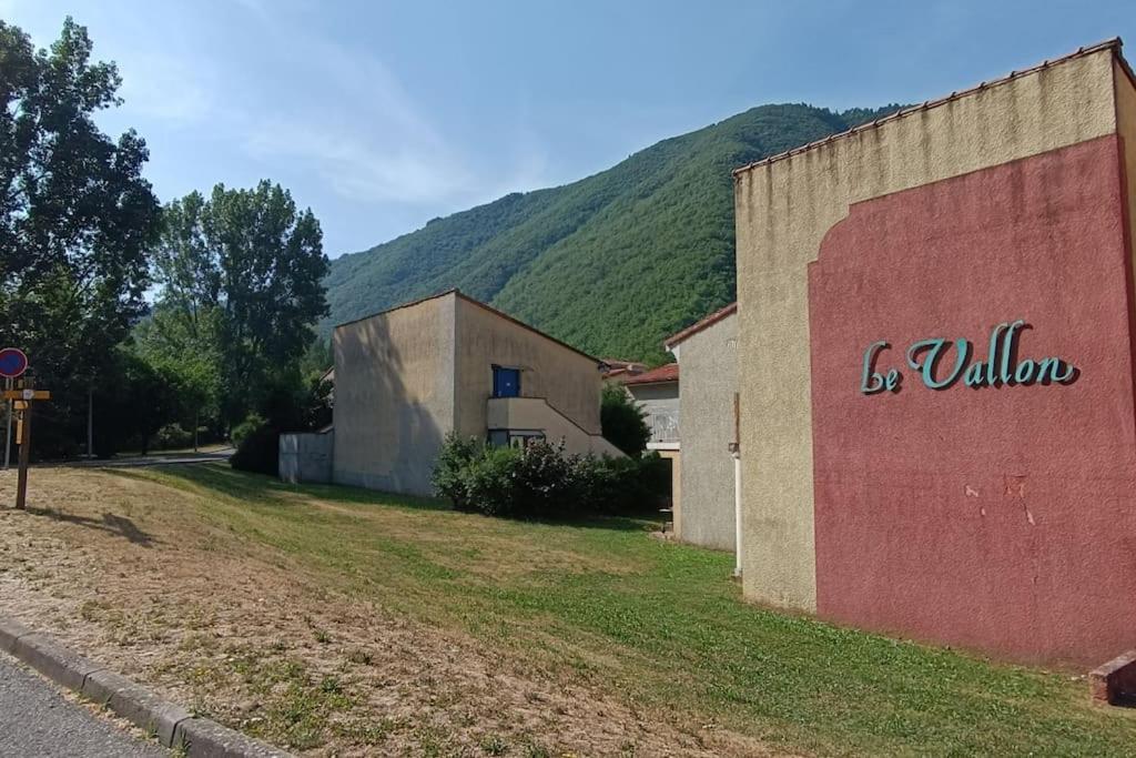a building with the words bella on the side of it at T2 au cœur de la nature de Digne in Digne-les-Bains