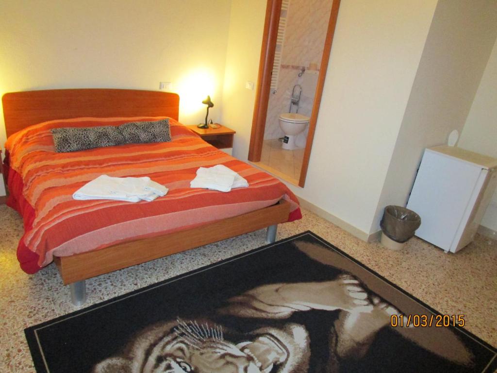 a bedroom with a bed with a picture of a zebra at San Marco in Pisa