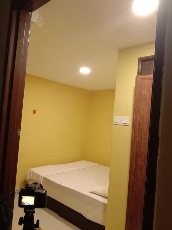 Postel nebo postele na pokoji v ubytování RAS Hotel