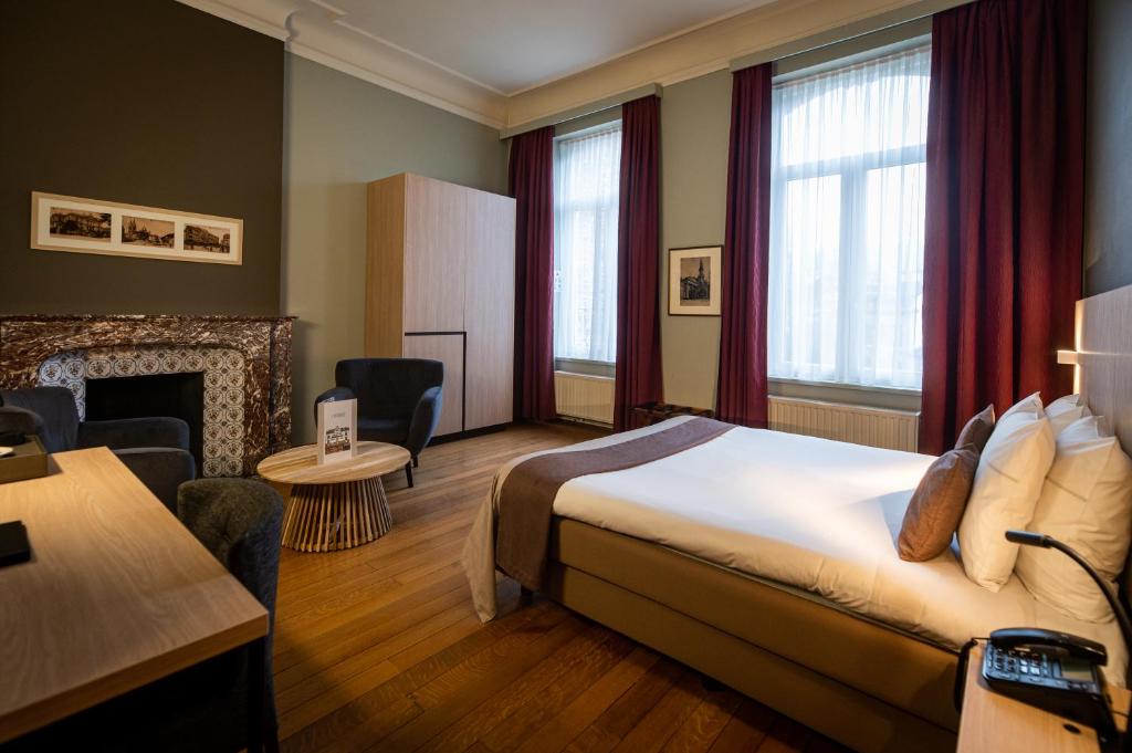 Postel nebo postele na pokoji v ubytování La Villa des Fleurs