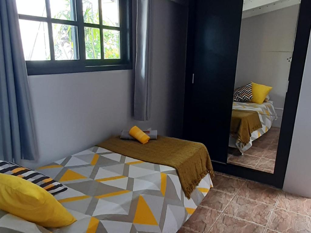 Villacasamarela mini casinhas de hospedes Rio vermelhoにあるベッド