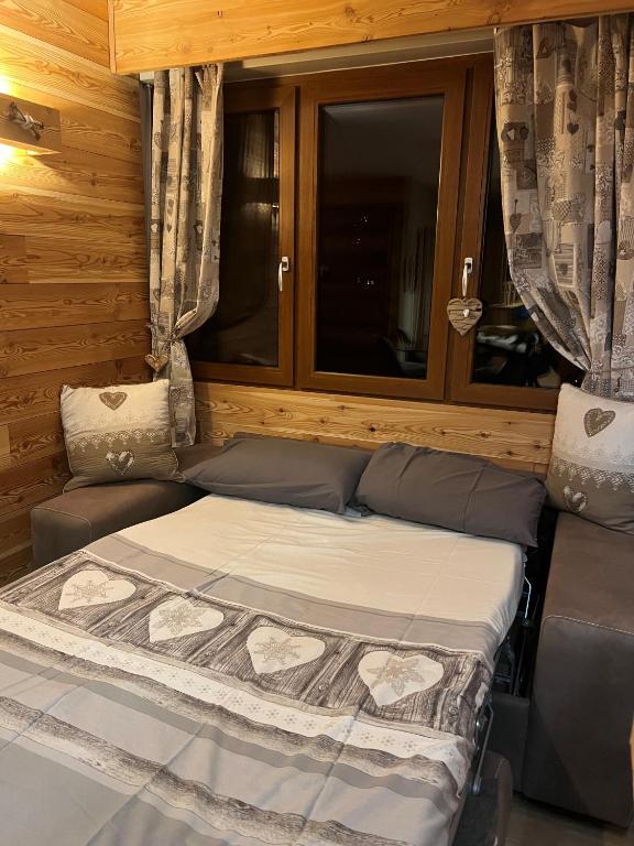 Postel nebo postele na pokoji v ubytování MiniChalet studio a Limone Piemonte