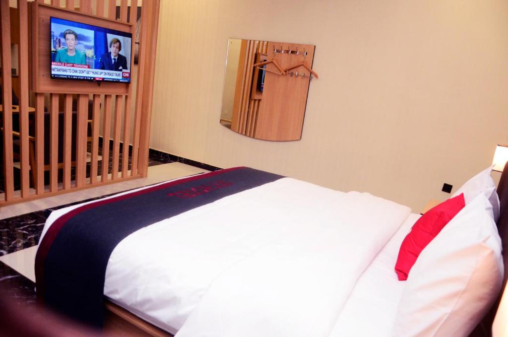 Ένα ή περισσότερα κρεβάτια σε δωμάτιο στο Ivy Hotel Emerald