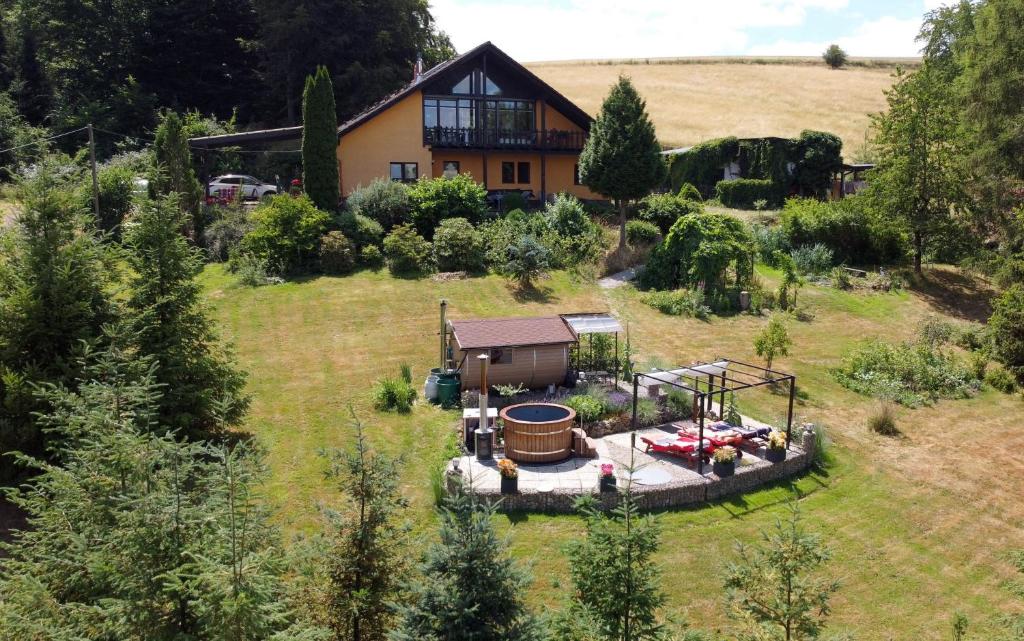 an aerial view of a house with a yard at Sylvias Ranch in Gerstungen