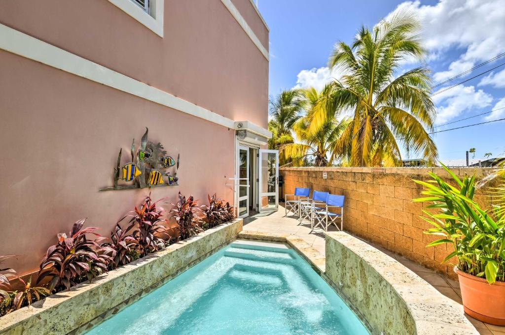 a swimming pool in the backyard of a house at Fajardo Townhouse with Private Pool and Ocean View in Fajardo