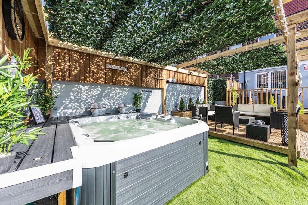 a hot tub in the middle of a yard at Stunning house close to the stadium + Hot tub! in Liverpool