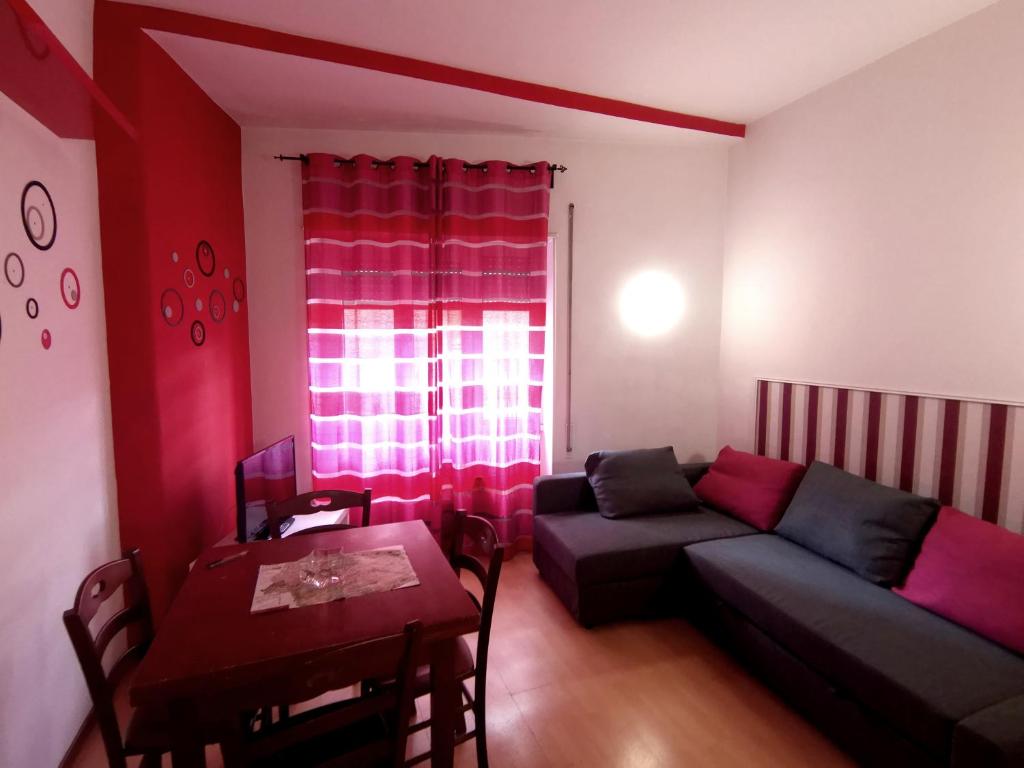 a living room with a couch and a table at My Vatican House in Rome