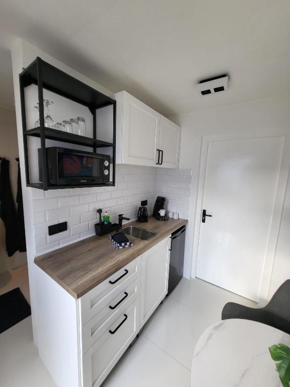 Kuchyň nebo kuchyňský kout v ubytování Appartement S2