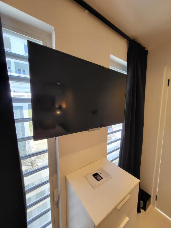 TV a/nebo společenská místnost v ubytování Appartement S2