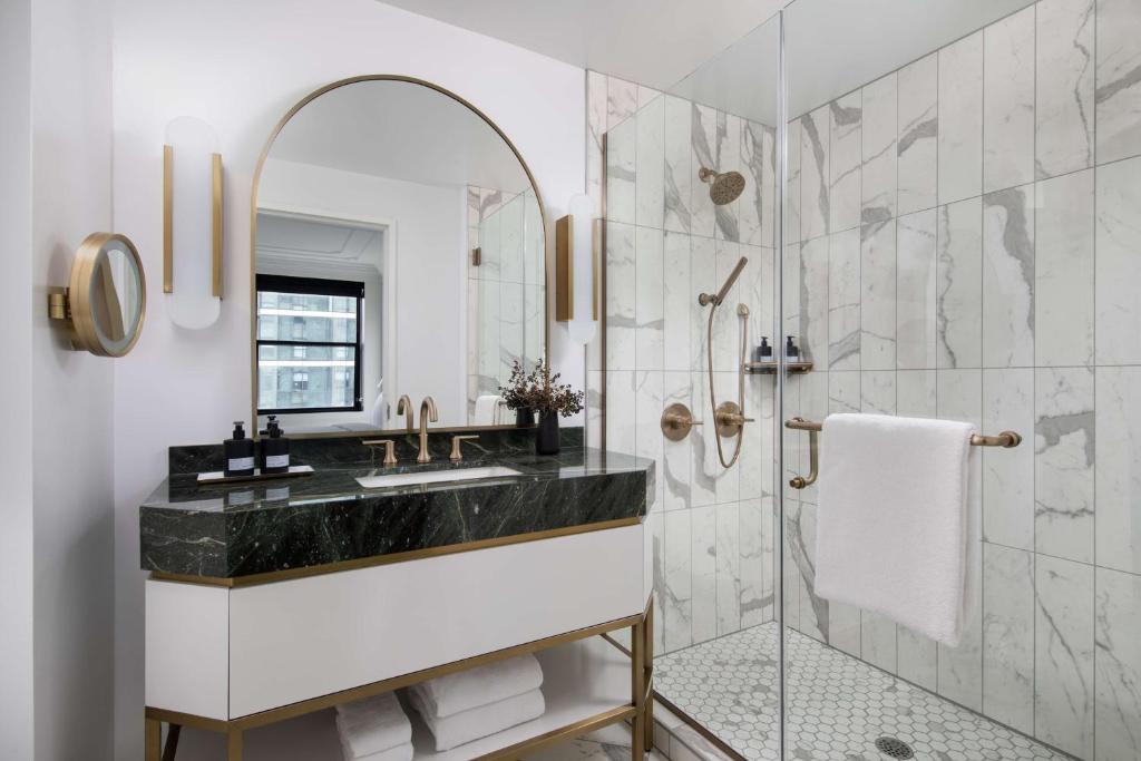 a bathroom with a sink and a shower at Pendry Chicago in Chicago