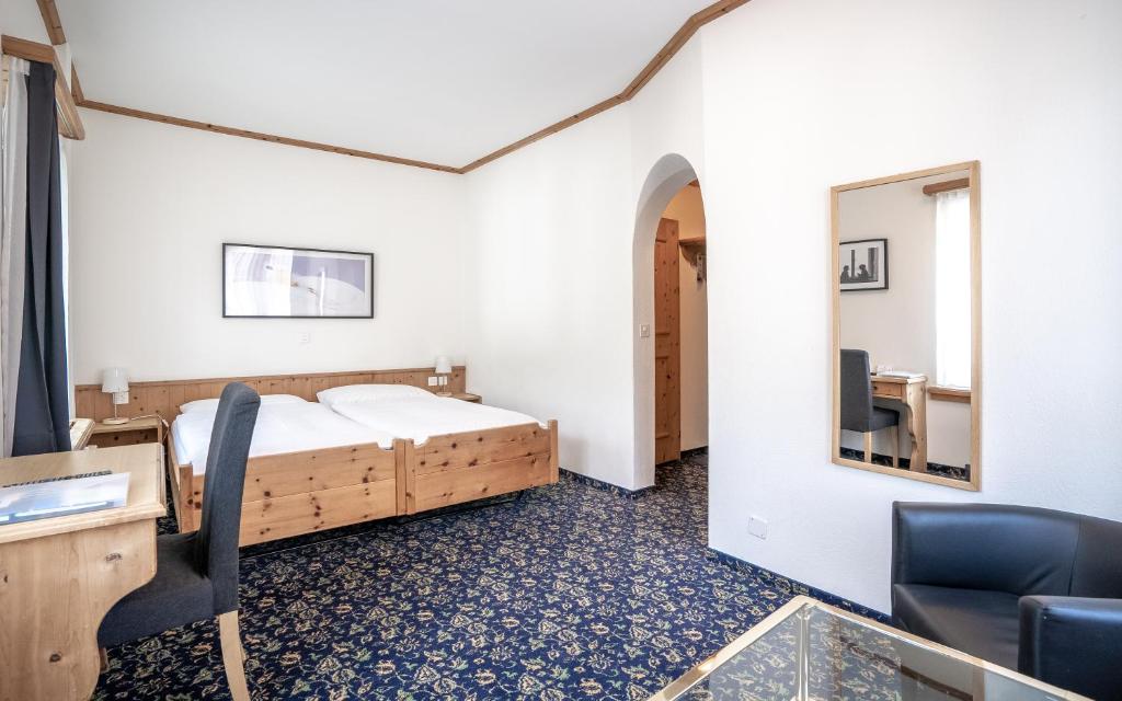 Postel nebo postele na pokoji v ubytování Hotel Alte Post by Mountain Hotels