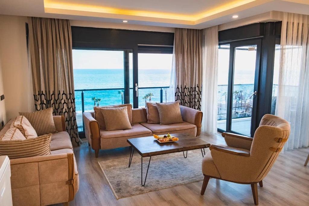 a living room with a couch and a table at ONLY ONE Suites & Residences in Antalya
