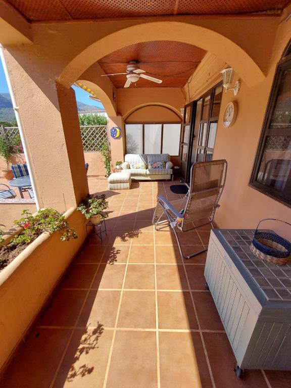 a view of a patio with a table and chairs at Mi Casa in Turre