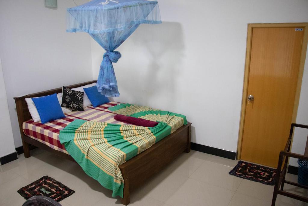 Postel nebo postele na pokoji v ubytování Freedom Home Stay