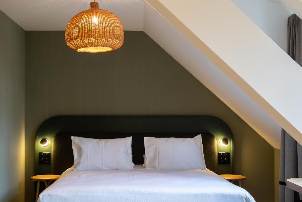 Postel nebo postele na pokoji v ubytování Boutique Hotel Waldhaus beider Basel