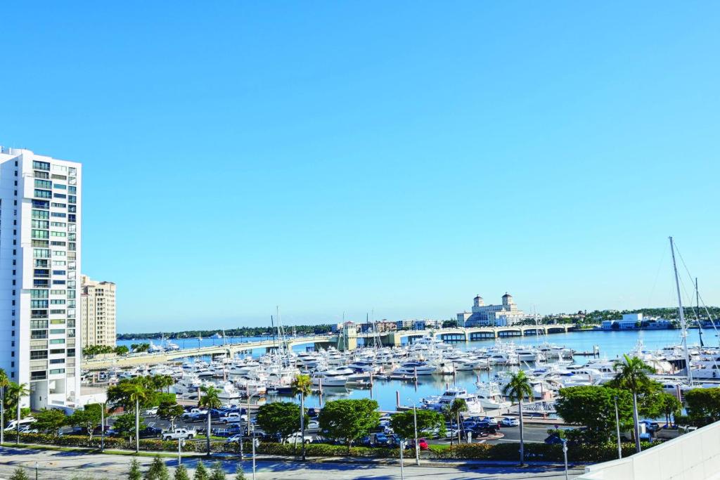 a view of a marina with boats in the water at The Ben, Autograph Collection in West Palm Beach