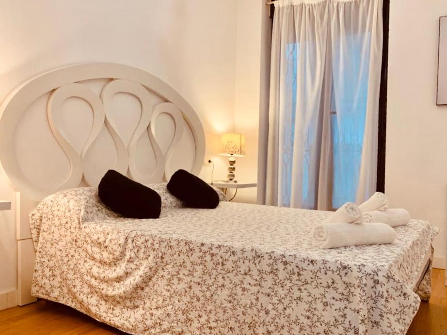 A bed or beds in a room at BONITO PISO EN PLENO CENTRO CON PaRKING OPCIONAL