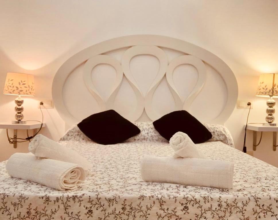 A bed or beds in a room at BONITO PISO EN PLENO CENTRO CON PaRKING OPCIONAL