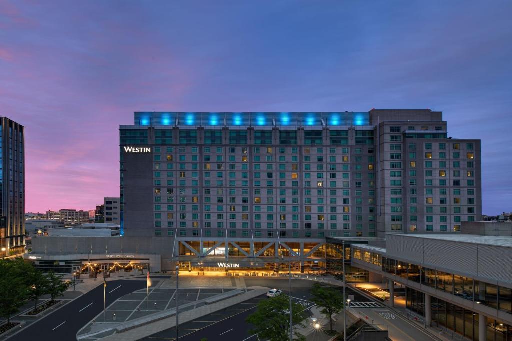 a building with blue lights on top of it at The Westin Boston Seaport District in Boston