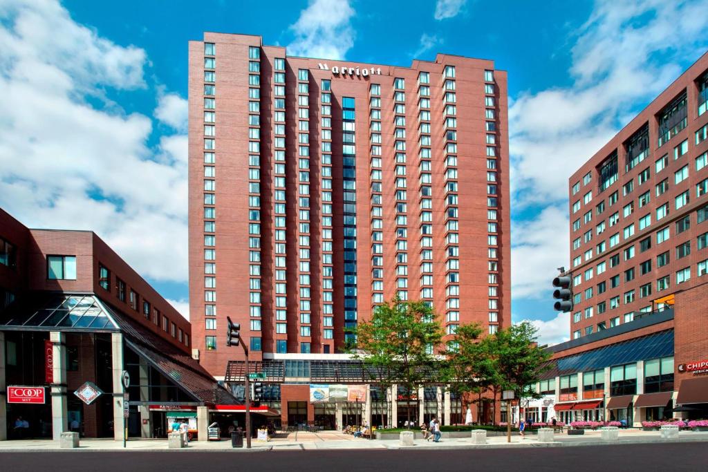 a large red building on a city street at Boston Marriott Cambridge in Cambridge