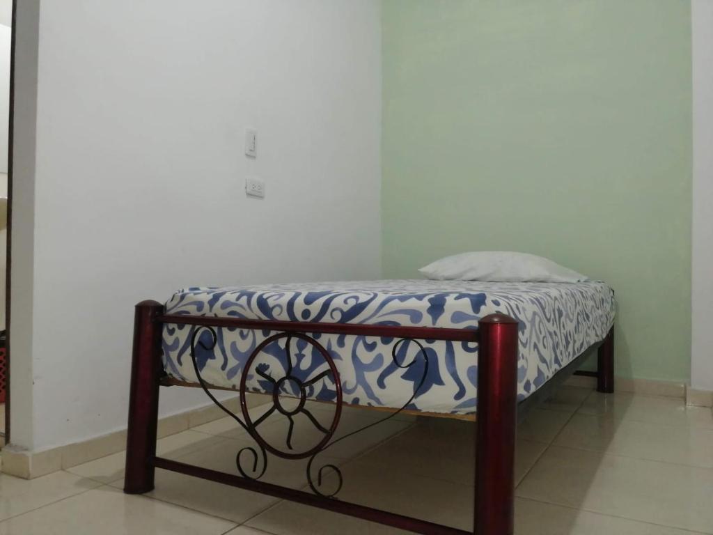 Postel nebo postele na pokoji v ubytování Guayacan Hostel