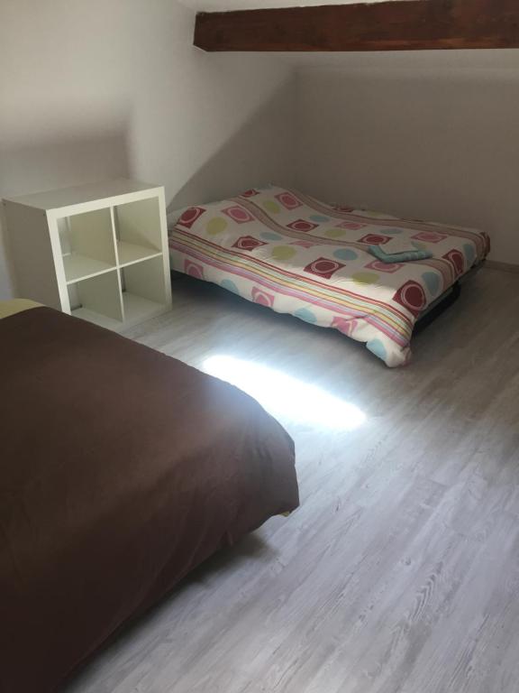Łóżko lub łóżka w pokoju w obiekcie Villa Emma 10 / 12 personnes