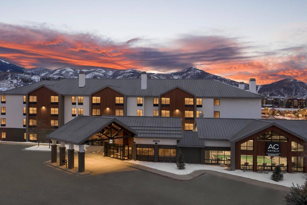 a rendering of a hotel with mountains in the background at AC Hotel Park City in Park City