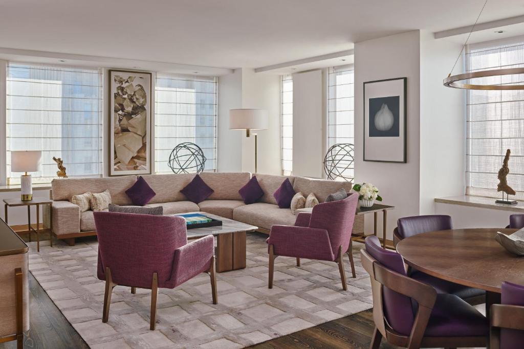 a living room with a couch and a table at The St. Regis San Francisco in San Francisco