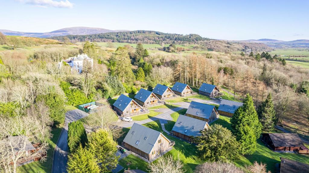 an aerial view of a house with blue roofs at Lord Galloway 35 with Hot Tub in Newton Stewart