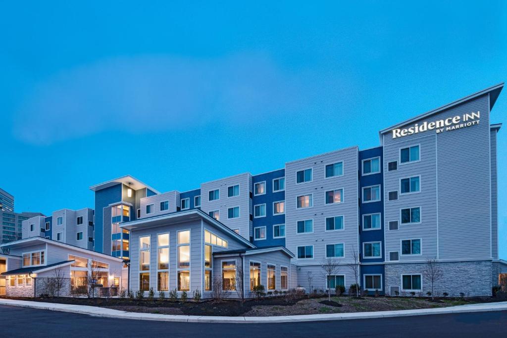 a rendering of a hotel building at night at Residence Inn New Brunswick Tower Center Blvd. in East Brunswick