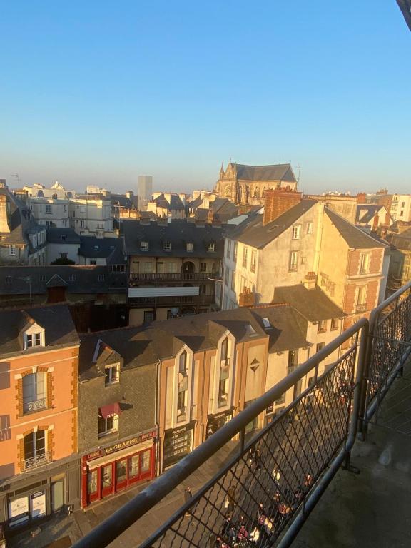 a view of a city from a balcony at Hotel Des Lices in Rennes