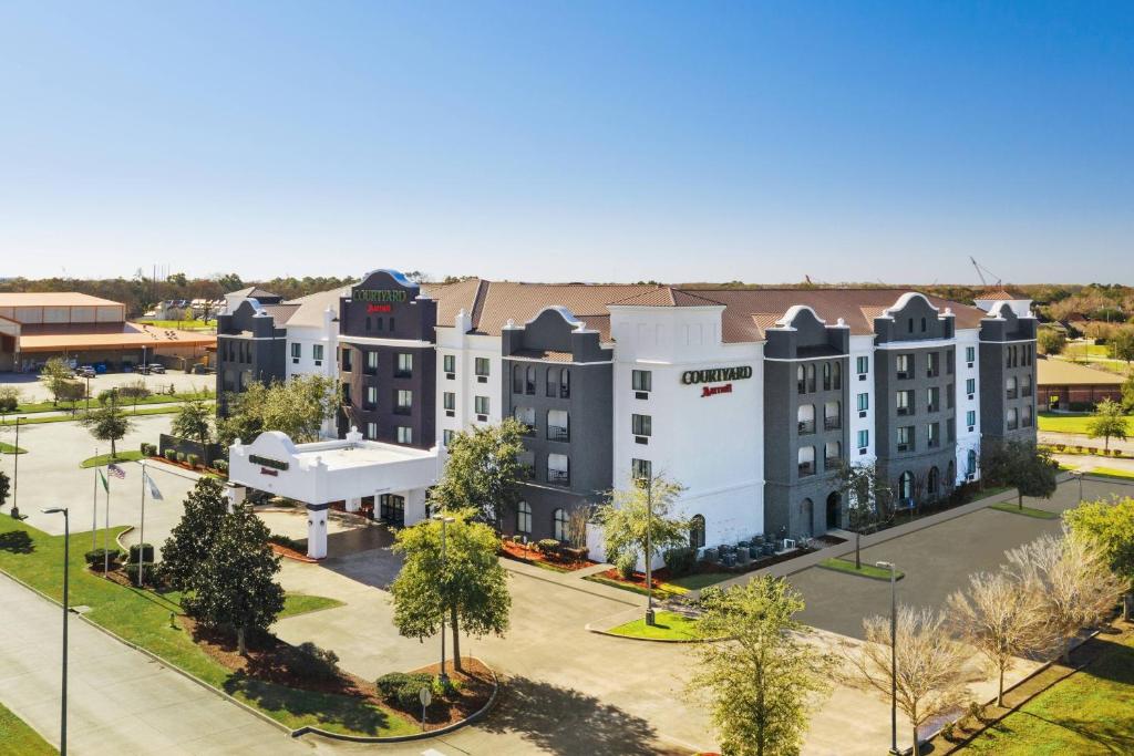 an aerial view of a campus with buildings at Courtyard by Marriott Houma in Houma
