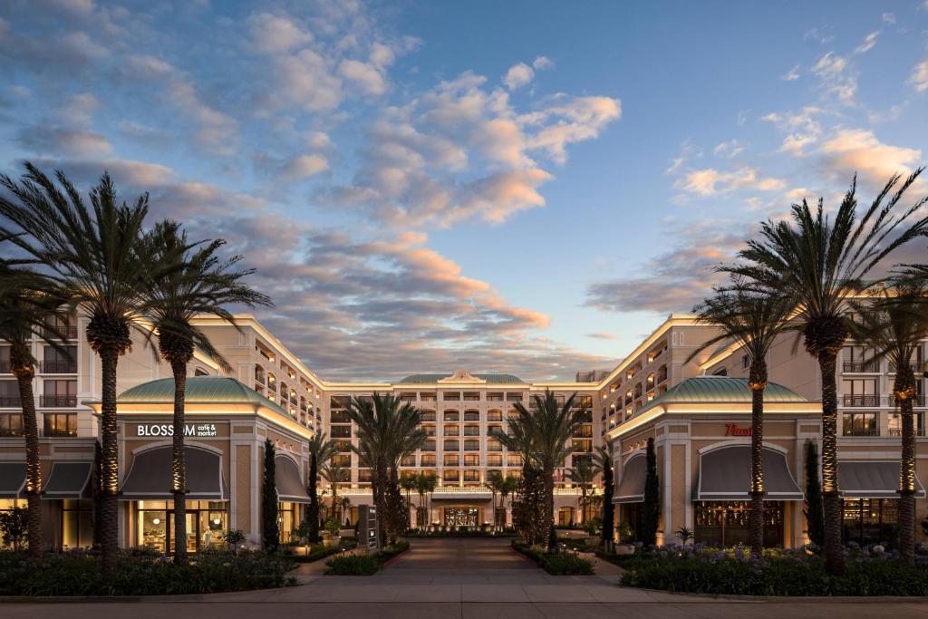 a rendering of a building with palm trees in front at The Westin Anaheim Resort in Anaheim