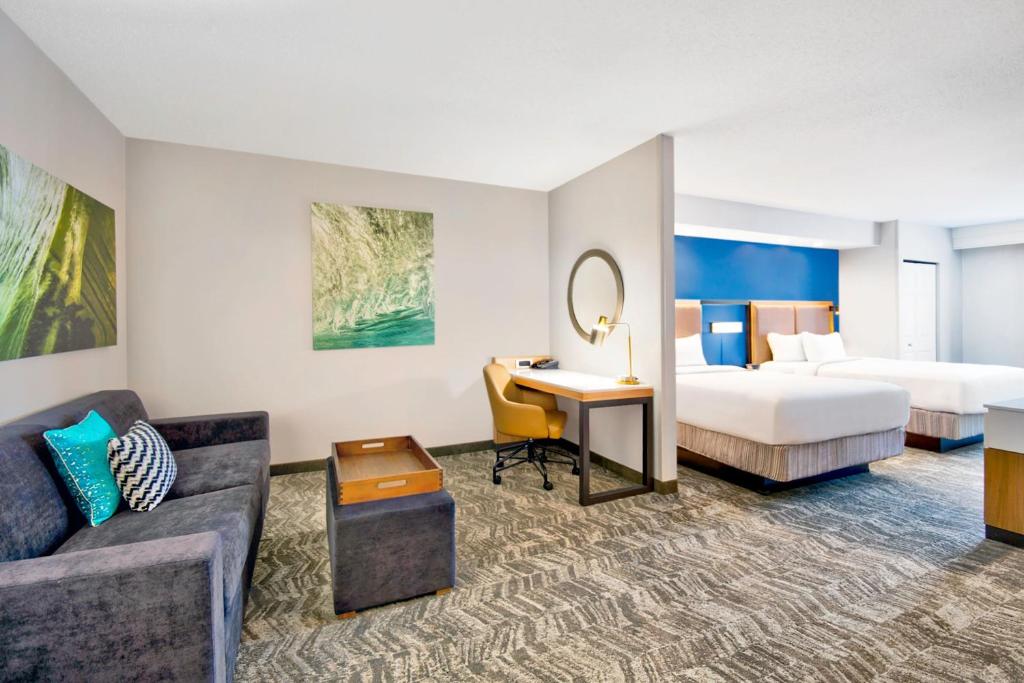 a hotel room with a bed and a desk at SpringHill Suites By Marriott Erie in Erie