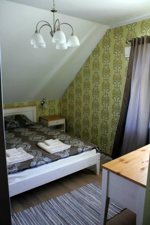 Postel nebo postele na pokoji v ubytování Veski Külalistemaja