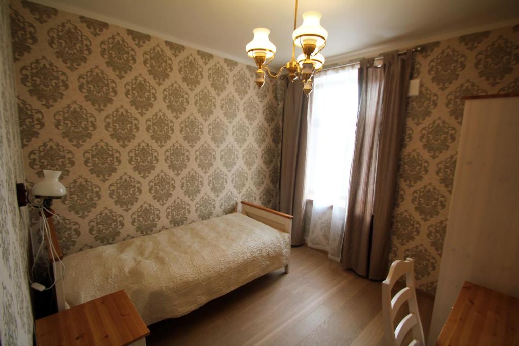 Кровать или кровати в номере Veski Külalistemaja