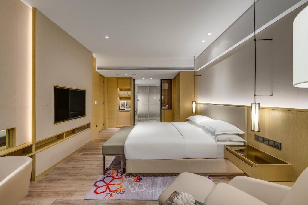 Postel nebo postele na pokoji v ubytování Kaohsiung Marriott Hotel