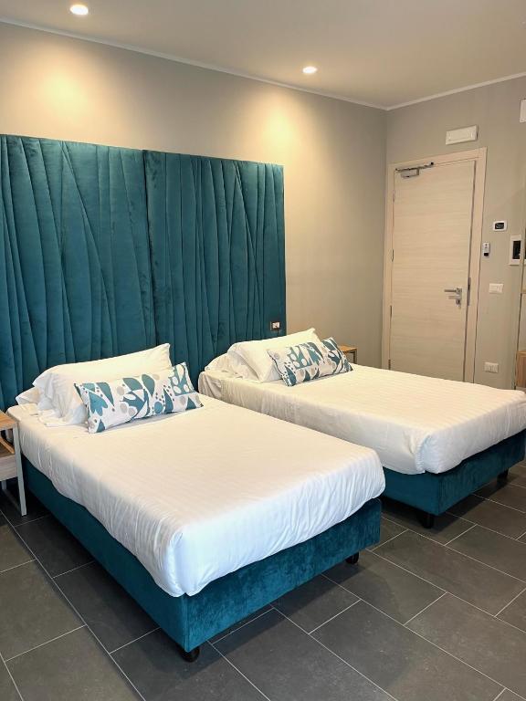 Postel nebo postele na pokoji v ubytování Hotel Sant'Elia