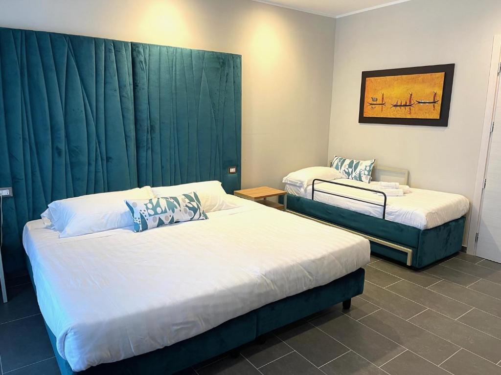 Postel nebo postele na pokoji v ubytování Hotel Sant'Elia