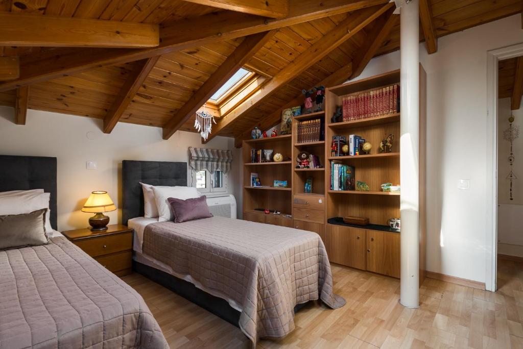 A bed or beds in a room at Myronis Villa Corfu Town