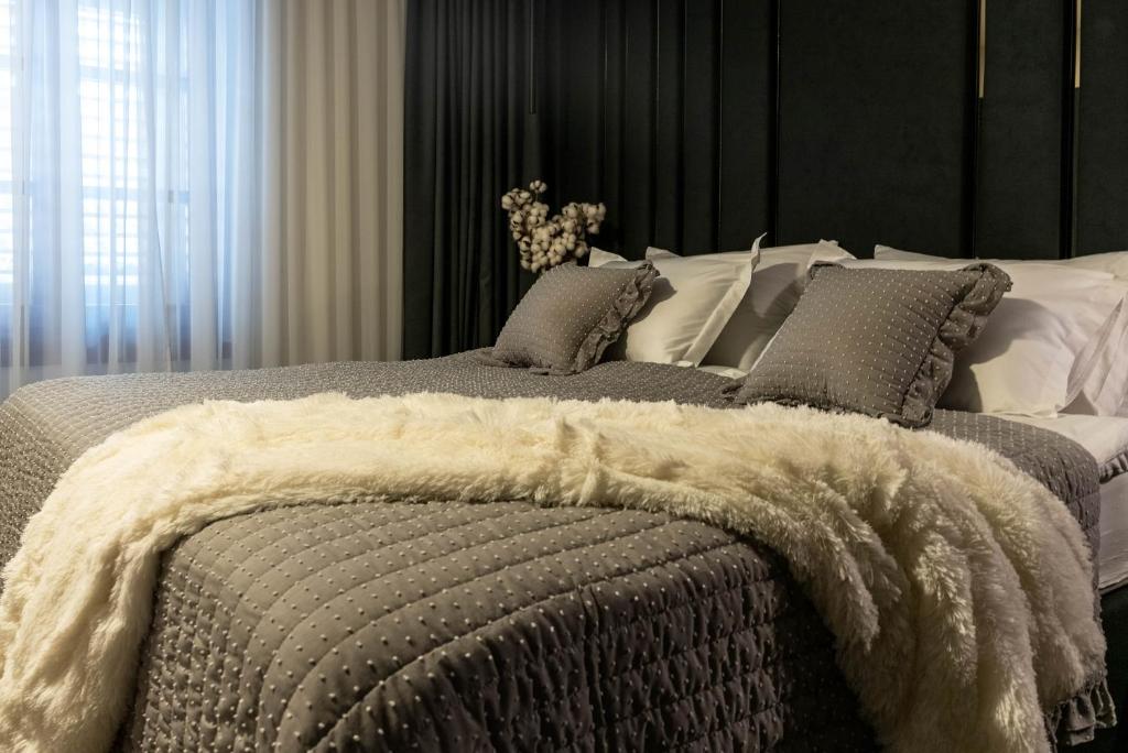 Łóżko lub łóżka w pokoju w obiekcie City Premium Rooms Old town