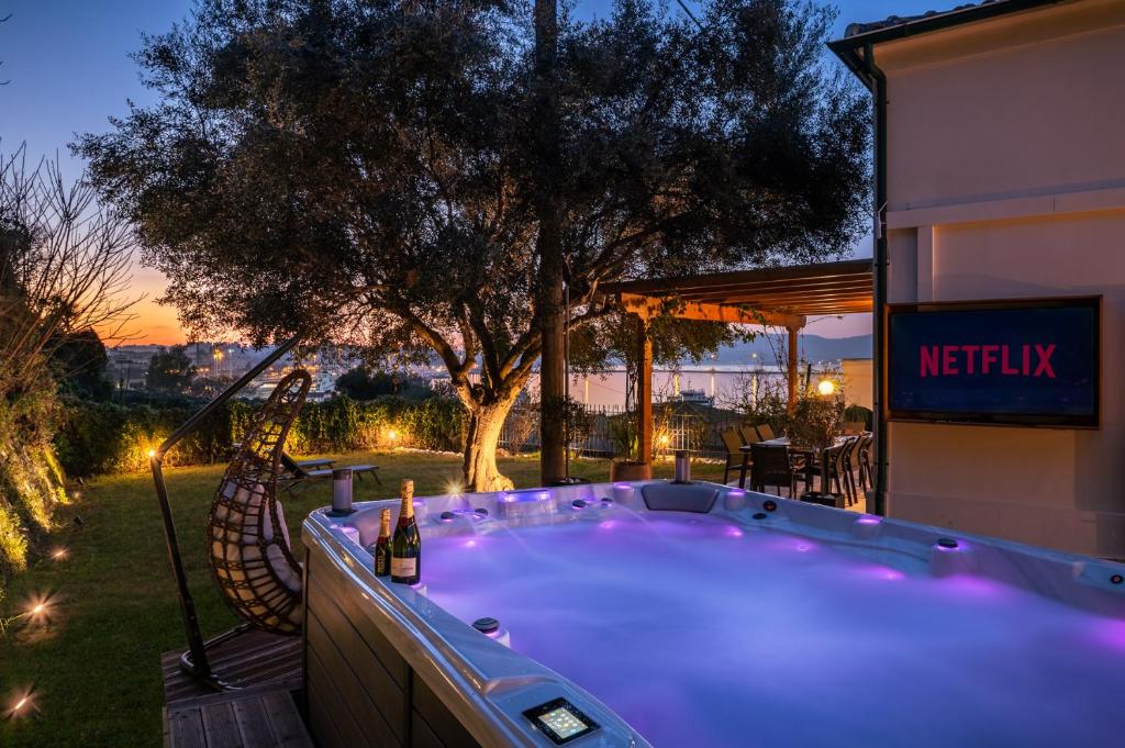 a hot tub in the backyard of a house at Myronis Villa Corfu Town in Corfu Town